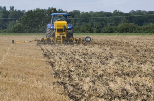 A tractor drilling oilseed rape seeds